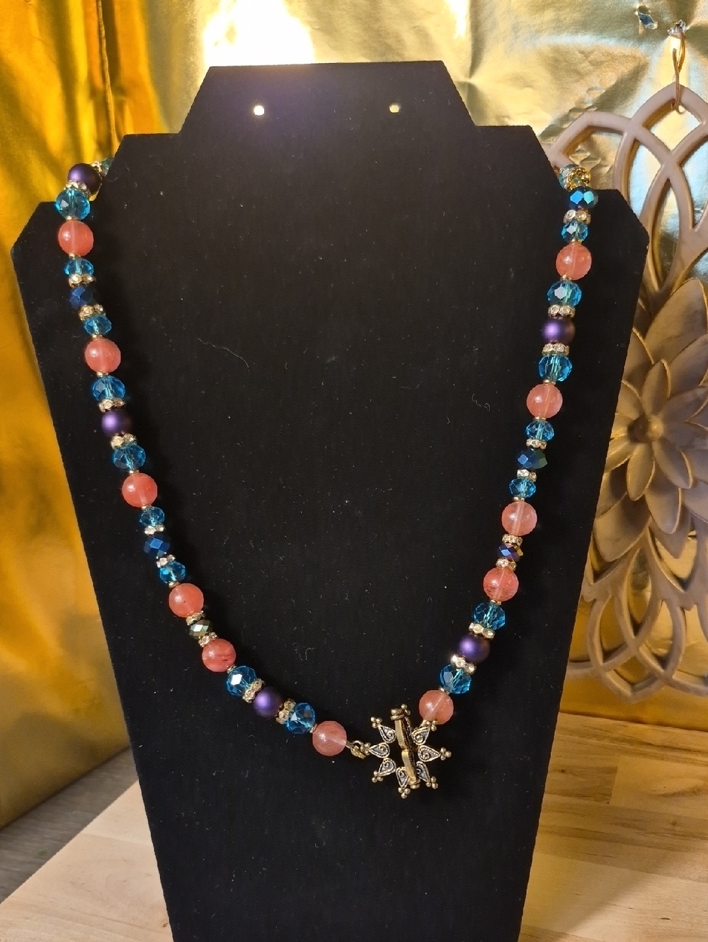 Handcrafted Pink and Blue Beaded Necklace with Gold Snowflake Pendant